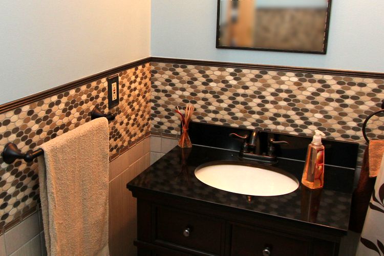 Fancy tile work featured in the complete bathroom makeover.